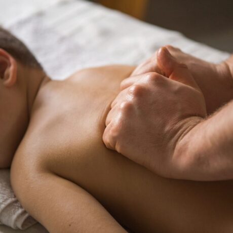 boy-toddler-relaxes-from-therapeutic-massage-physiotherapist-working-with-patient-clinic-back-child7-less-1024×683-1.jpg